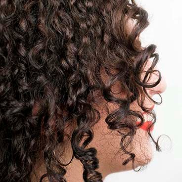 Garnier Fructis - Defined Curls - wearing hair down, make most of naturally curly hair by creating soft, defined curls look with Curl Stretch Loosening Pudding